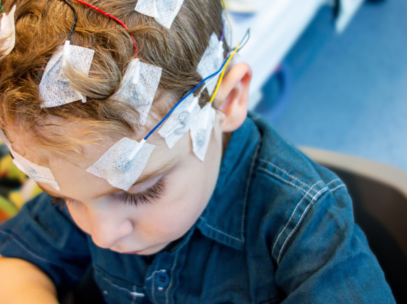 Child with Epilepsy readers on their head