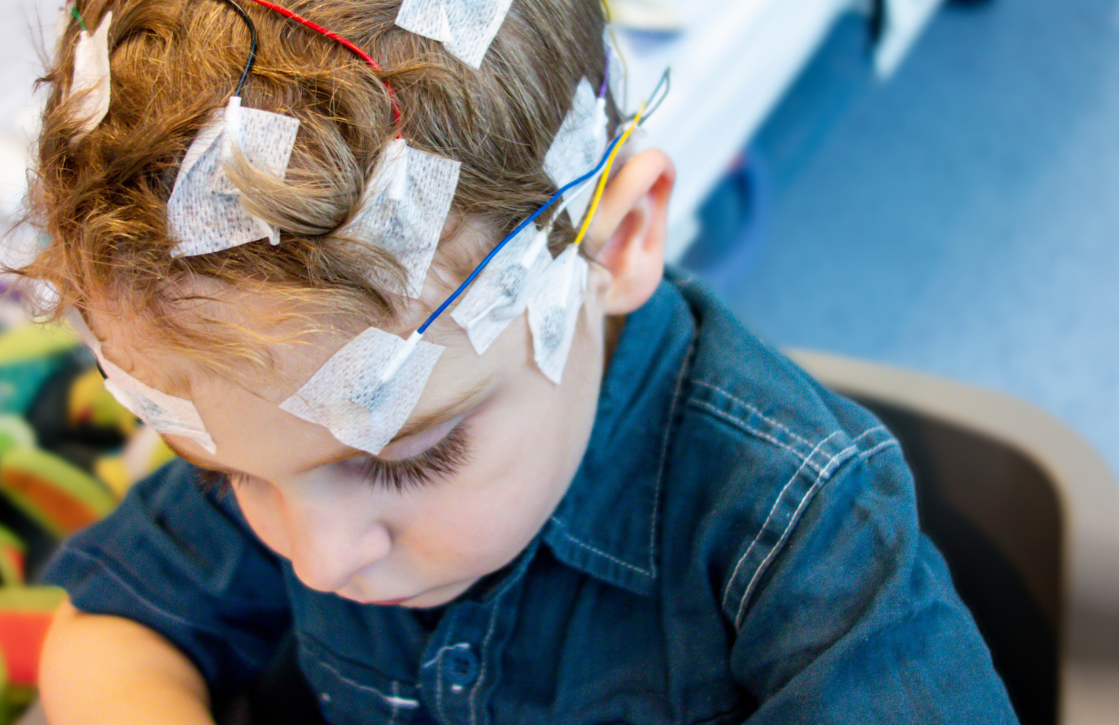 Child with Epilepsy readers on their head